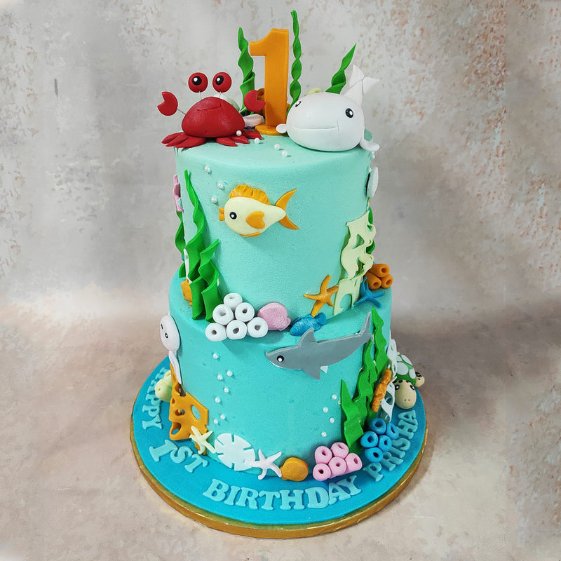 A fun under the sea themed birthday cake and desserts for Azlina's