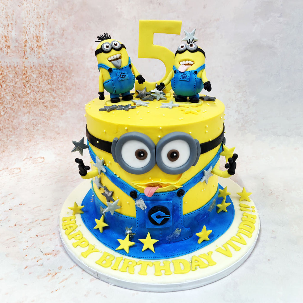 The entire 3D Minions Cake design cleverly transforms into a cheerful character, complete with signature goggled eyes and a cheeky grin. 