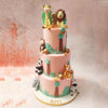 At the top of this 3 Tier Safari Cake, a cheerful giraffe and a majestic lion, symbolic of strength and leadership, stand proudly. 