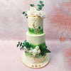 Adorning the top two tiers of this 3 Tier Green Floral Cake are delicate white roses, symbolising purity, love, and new beginnings. 