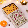 A zesty cranberry orange teacake on a diwali box