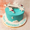 The Aeroplane Cake's blue frosting mimics the expansive sky, providing a perfect backdrop for the floating clouds crafted with precision and care. 