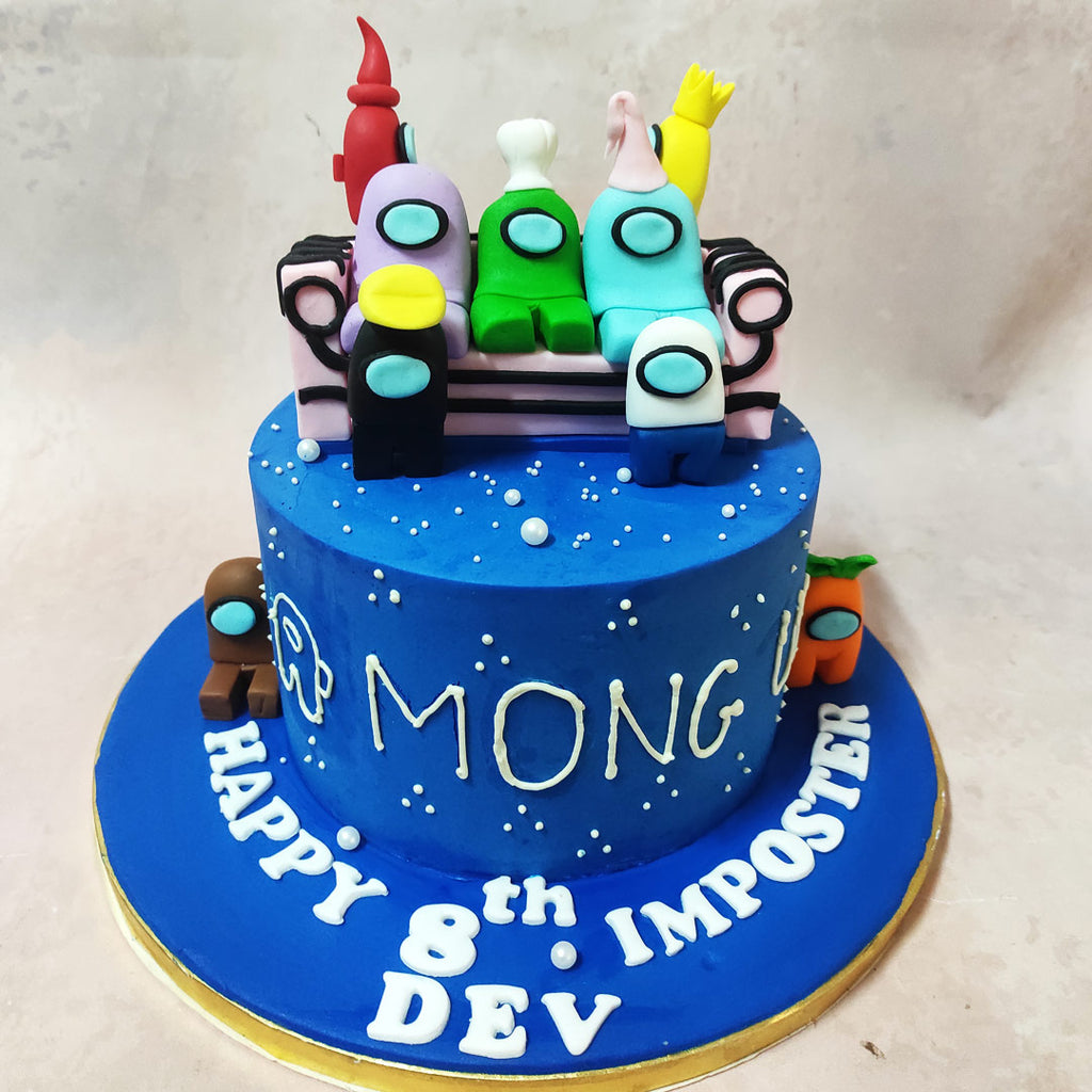 This Game Theme Cake design features edible white pearls, resembling stars, twinkle mysteriously, adding an aura of suspense to the cosmic scene.
