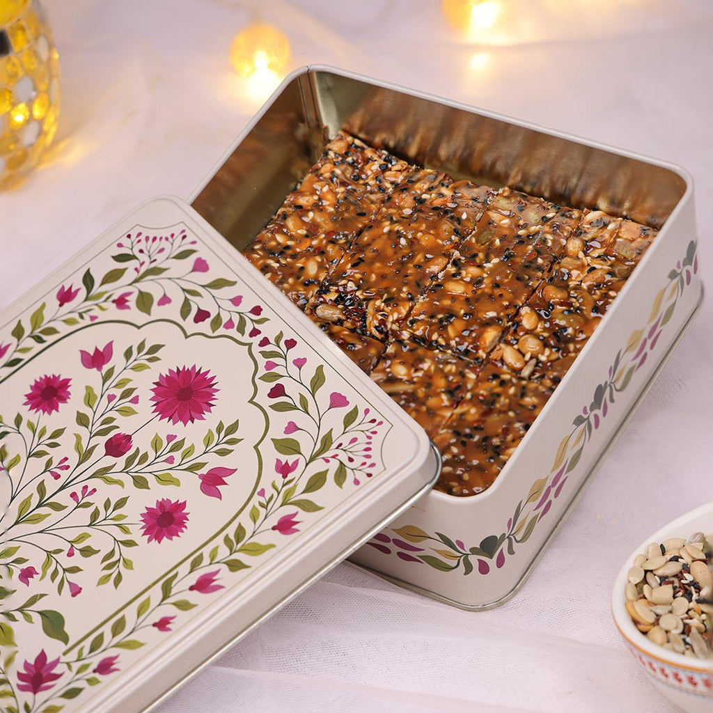 Diwali gift tin filled with trail mix Florentine slabs