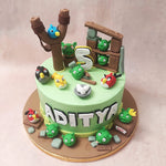 Around eight pigs, each with a cheeky grin, add a playful touch to the scene of this Game Theme Cake 