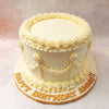 This Buttercream Lace Cake's intricate buttercream lace detailing showcases the artistry and craftsmanship involved in its creation, setting it apart as a truly unique and beautiful piece.