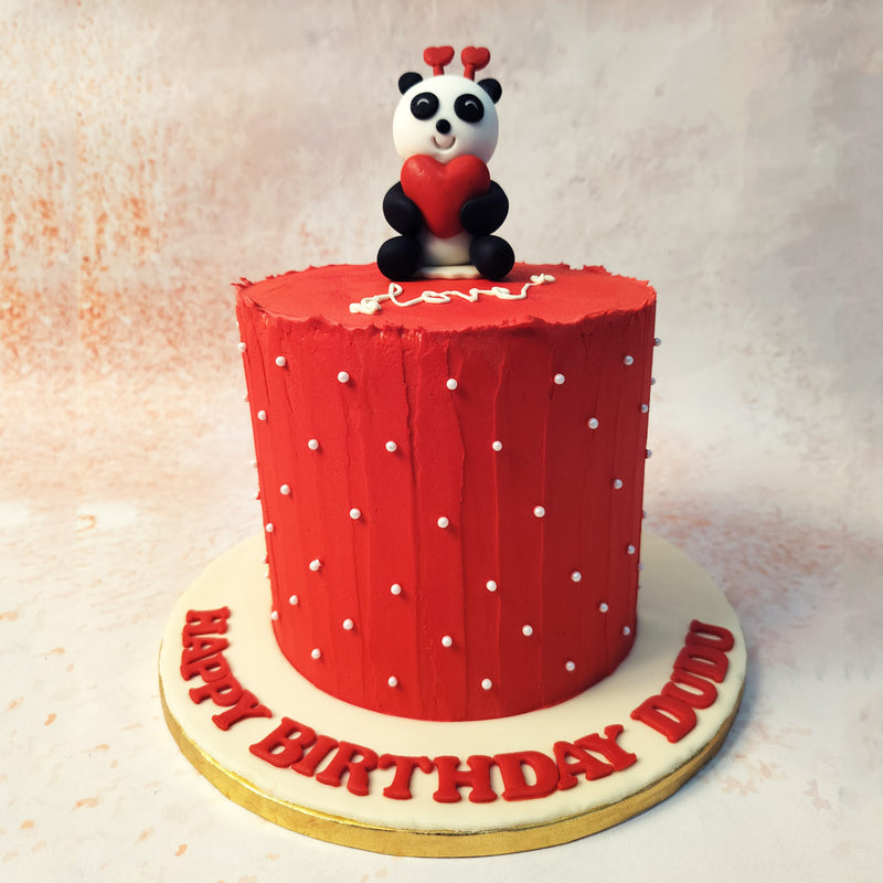 The panda, with its adorable heart and endearing smile, sits proudly atop this Anniversary Cake, symbolising love and warmth, making it an ideal centrepiece for any celebration.