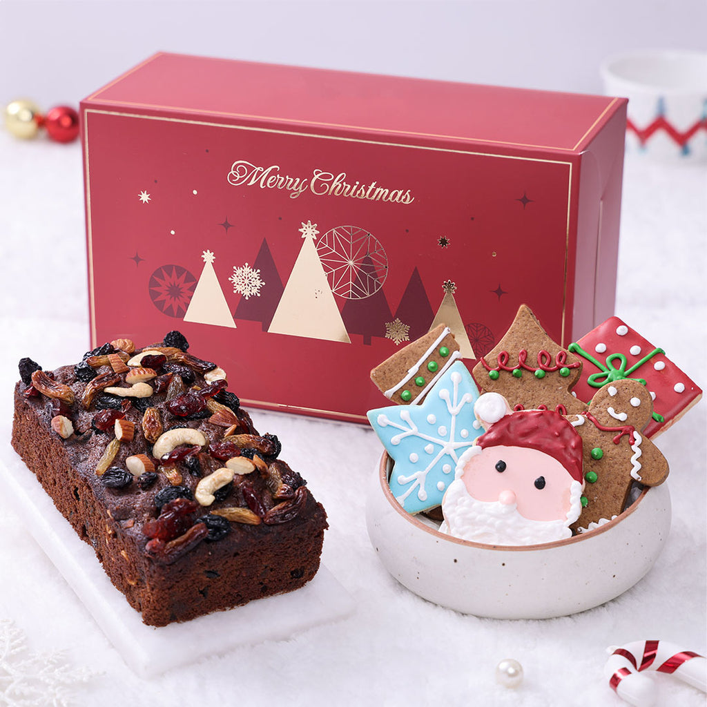 Luxury Artisanal Xmas Gift Hamper in a red box, containing a rich Christmas Plum Cake loaf and assorted festive sugar and gingerbread cookies.