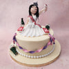 Featuring a cream white base, embellished with edible ribbons and pearls around the circumference, this bridal shower cake design centres around the topper: a figurines of a drinking bride in her white wedding dress, with a sash around her torso and a tiara on her head. 