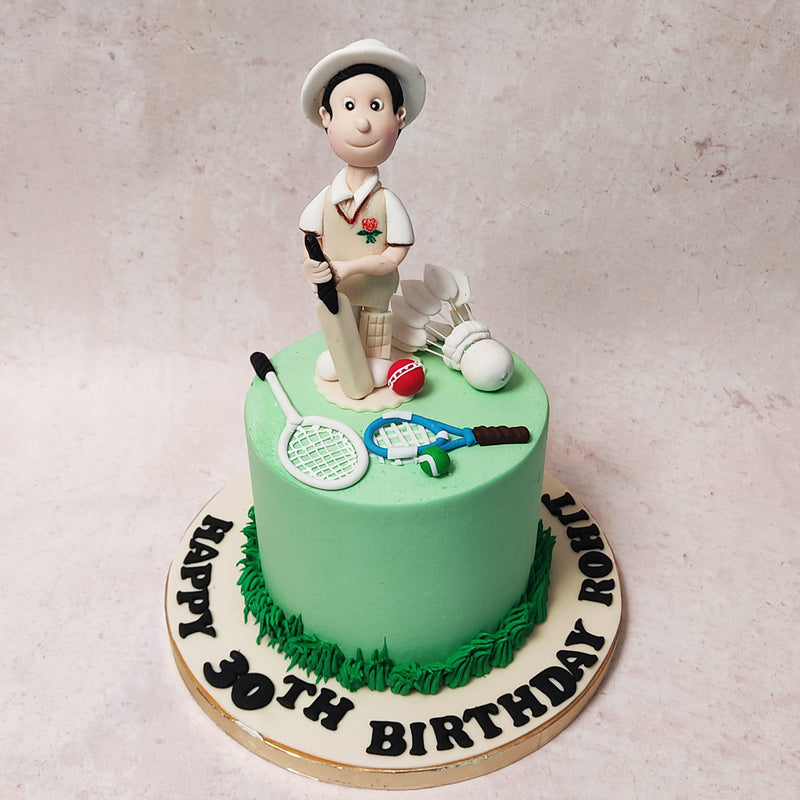 The bottom of this sports cake boasts an impeccably piped, dark green grass buttercream, each blade standing tall like a well-manicured pitch ready for play