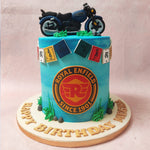 The towering aubrey blue base of this Royal Enfield Cake, features lettered flags adorning the top. 