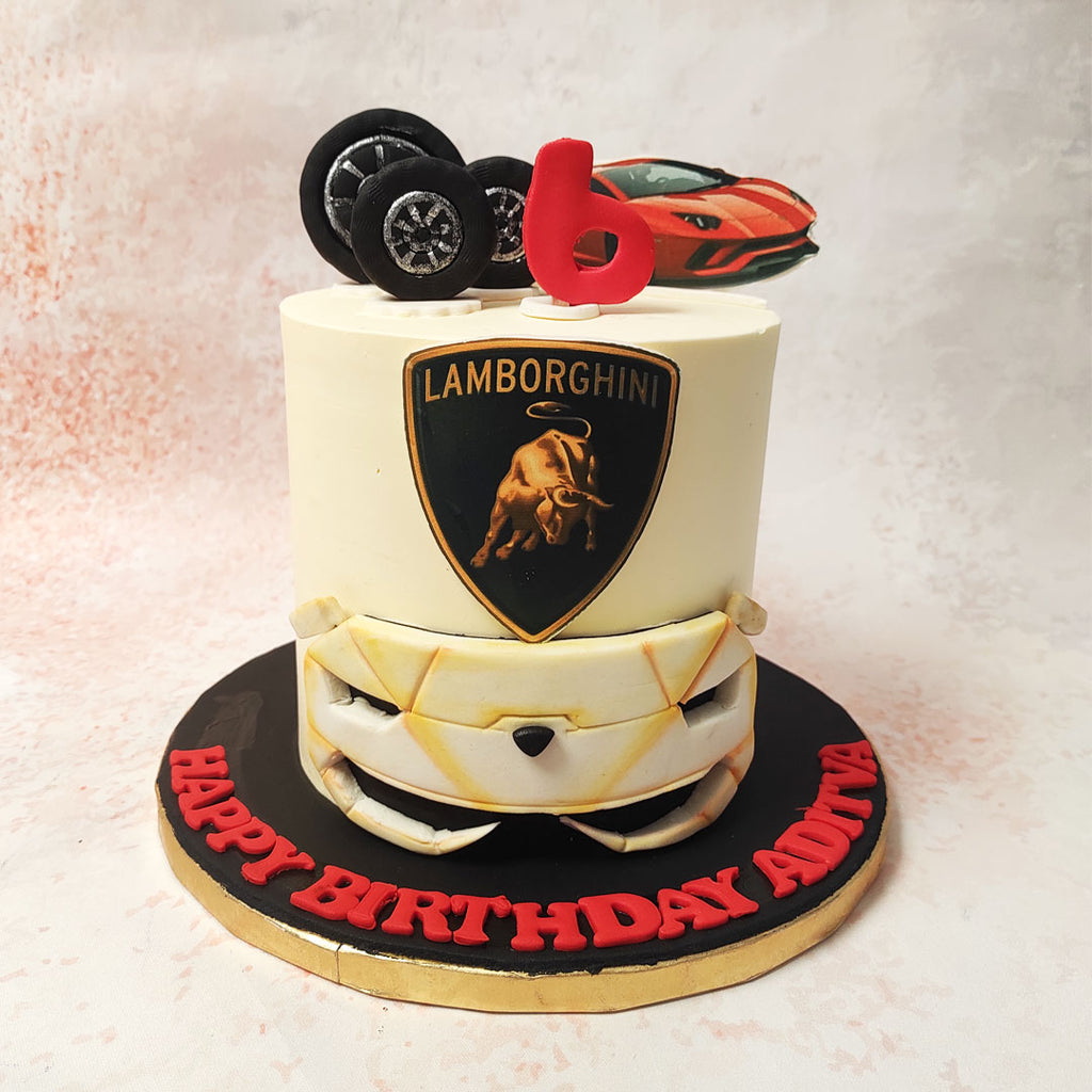 The front  of this Lamborghini Cake showcases a meticulously crafted fondant representation of the Lamborghini's sleek and aggressive grille, a nod to the car's distinctive design and aerodynamics.