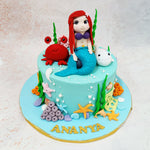 Her serene expression and starfish hair accessory bring a sense of wonder and fantasy to this Birthday Cake For Girls while evoking the timeless allure of mermaid folklore.