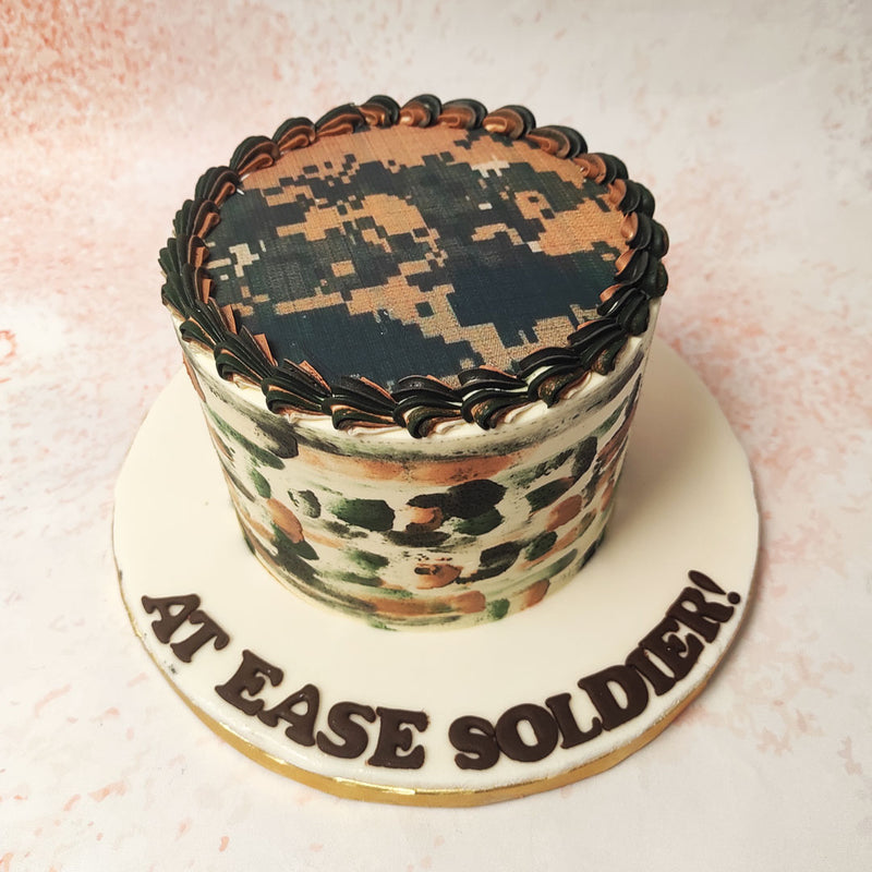 This striking Camo Cake captures the essence of a military theme with its bold camouflage design and detailed decorations. 