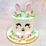 What makes this Birthday Cake For Kids especially delightful is the full bunny-face transformation: tiny edible paws at the base, a soft vanilla canvas for the fur, and dainty sugar flowers nestled all around. 