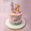 Atop the base of this bear and rabbit cake sits an orange bear, a symbol of strength and protection. 