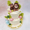 Scattered throughout this Jungle Theme Birthday Cake For Kids are perfectly rounded baubles in soft pastel pink, fresh green, and pearl white, adding a contemporary touch to the safari theme. 