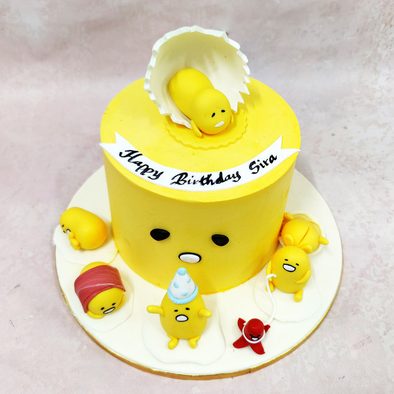 Two sleepy eyes and a meh-mouthed expression make this Birthday Cake For Kids instantly recognisable. Resting on a “egg white” surface, the cast of edible Gudetamas includes one fishing, one snoozing face-down, and another reluctantly celebrating.