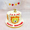 Above the lion’s crown, a miniature golden number and a string of flags in alternating red and yellow dance in celebration, giving this Birthday Cake For Kids a circus-meets-safari charm. 