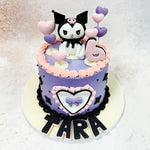 At the front of this Birthday Cake For Kids, the intricate heart and bow emblem is not only a nod to Kuromi’s rebellious yet sweet nature but also a symbol of fun and individuality, perfect for celebrating a bold and unique birthday.