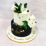 Fresh white roses and verdant green foliage crown the Birthday Cake For Wife, bringing natural elegance that symbolises purity and new beginnings—a tradition that dates back centuries in wedding celebrations.