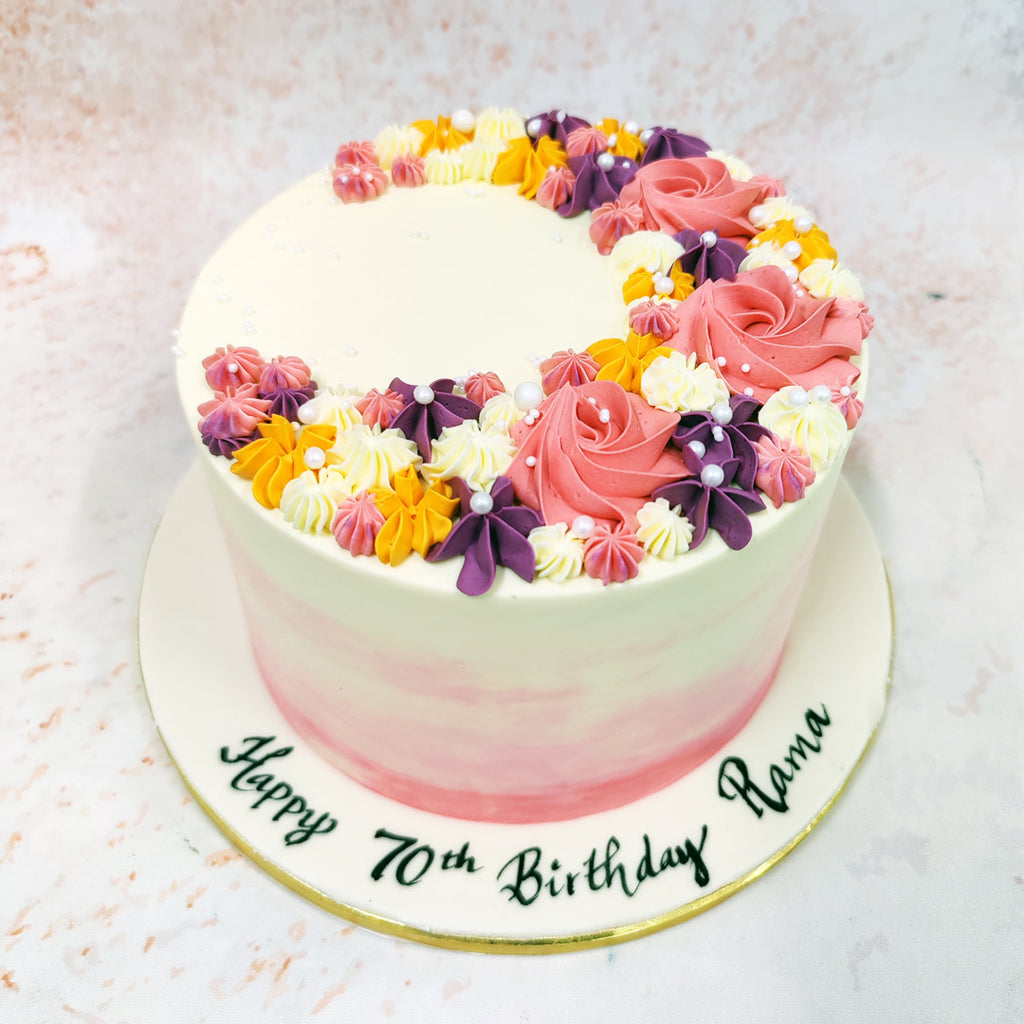Delicate pearl-like sugar decorations are scattered amongst the floral elements, adding a touch of elegance and sparkle to the Birthday Cake For Wife. 