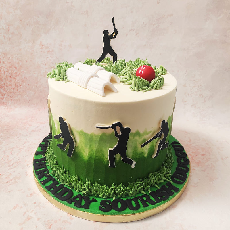 Silhouettes of cricketers in action—batting, bowling, and fielding—adorn the sides of this cricket-theme Birthday Cake For Dad, capturing the dynamic spirit and excitement of the sport.