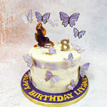 This Birthday Cake For Kids features a delicate colour palette of cream and soft lavender, creating an ethereal watercolour effect that mirrors the artistic spirit of the kingdom of Corona.