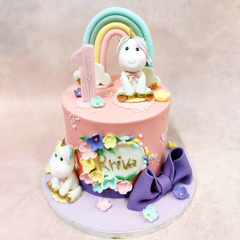 A striking feature of this Birthday Cake For Kids is the oversized purple bow, which adds a touch of elegance and contemporary styling to the magical theme. 
