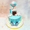 The design of this Birthday Cake For Kids showcases a dreamy sky-blue canvas decorated with cascading fluffy white clouds and a silver elements that create the illusion of gentle rain or twinkling stars.