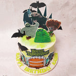 The wooden door at the centre of this Hotel Transylvania 2 birthday cake for kids design serves as an inviting portal into this whimsical universe and perched around the entrance are your favourite characters from the film. Adding an air of mystique to this design  are a bunch of bats fluttering around. 