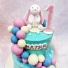 Perched atop this magical  Blue Bunny Cake sits an adorable bunny, crafted with remarkable attention to detail.