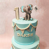 The design of this elephant birthday cake for kids is intentionally kept simple, allowing the charming elephant figurine to take centre stage. 