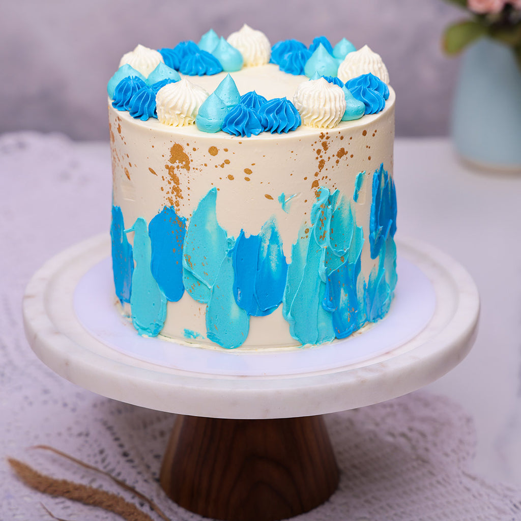 Blue and gold birthday cake