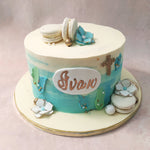 The edible floral decor on this sea themed baptism cake symbolises the beauty and growth that comes with embracing faith.