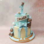 The top tier of this teddy bear birthday cake for kids features a soft baby blue base, reminiscent of a clear summer sky. 