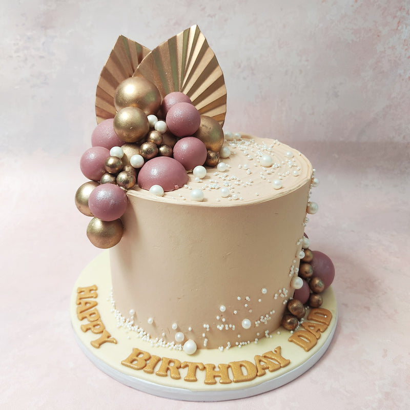 The purple and gold spheres evoke a sense of royalty and luxury through the design of this Abstract Cake, reminiscent of the treasures of a bygone era.