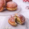 Italian Bomboloni filled with pistachio and dusted with powdered sugar
