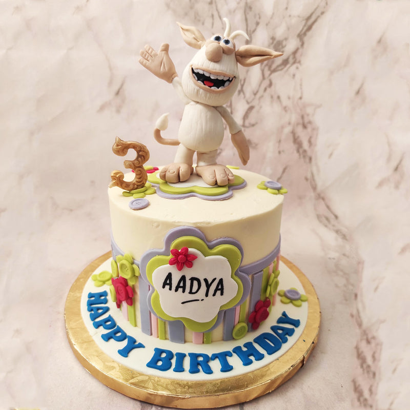 The white shade of this Booba birthday cake for kids serves as a blank canvas, symbolising the endless possibilities and imagination that Booba inspires in young minds. 