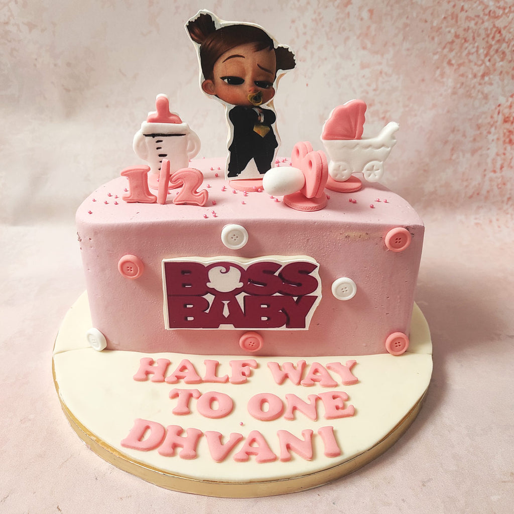 The centrepiece of this Girl Boss Baby Cake is an edible figurine of the Boss Baby herself, reimagined as a confident and empowered girl. With her adorable suit and signature pose, she symbolises the strength and determination of young girls everywhere. 
