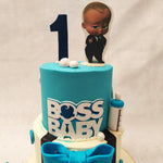 The top tier is adorned with a vibrant blue colour, reminiscent of the Boss Baby's iconic outfit. Complete with a logo and a cute feeding bottle on the side, this Boss Baby birthday cake for kids captures the essence of this mischievous yet lovable character.