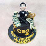 Sitting atop this Boss Cake is a charming figurine of a businessman in formal attire, complete with a black tuxedo and bow tie, holding what appears to be a coffee cup—the quintessential companion of any dedicated professional. 
