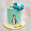 At its peak, Peter Rabbit, the charming bunny donned in white shoes and a denim jacket captures the essence of childhood adventure on this Bunny With Balloons Cake design.