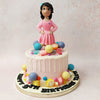 The real showstopper is the candy girl cake topper: a figurine of a little girl in a pink frock moulded in the likeness of a Disney Princess but stands proxy for the recipient of this candy drip cake.