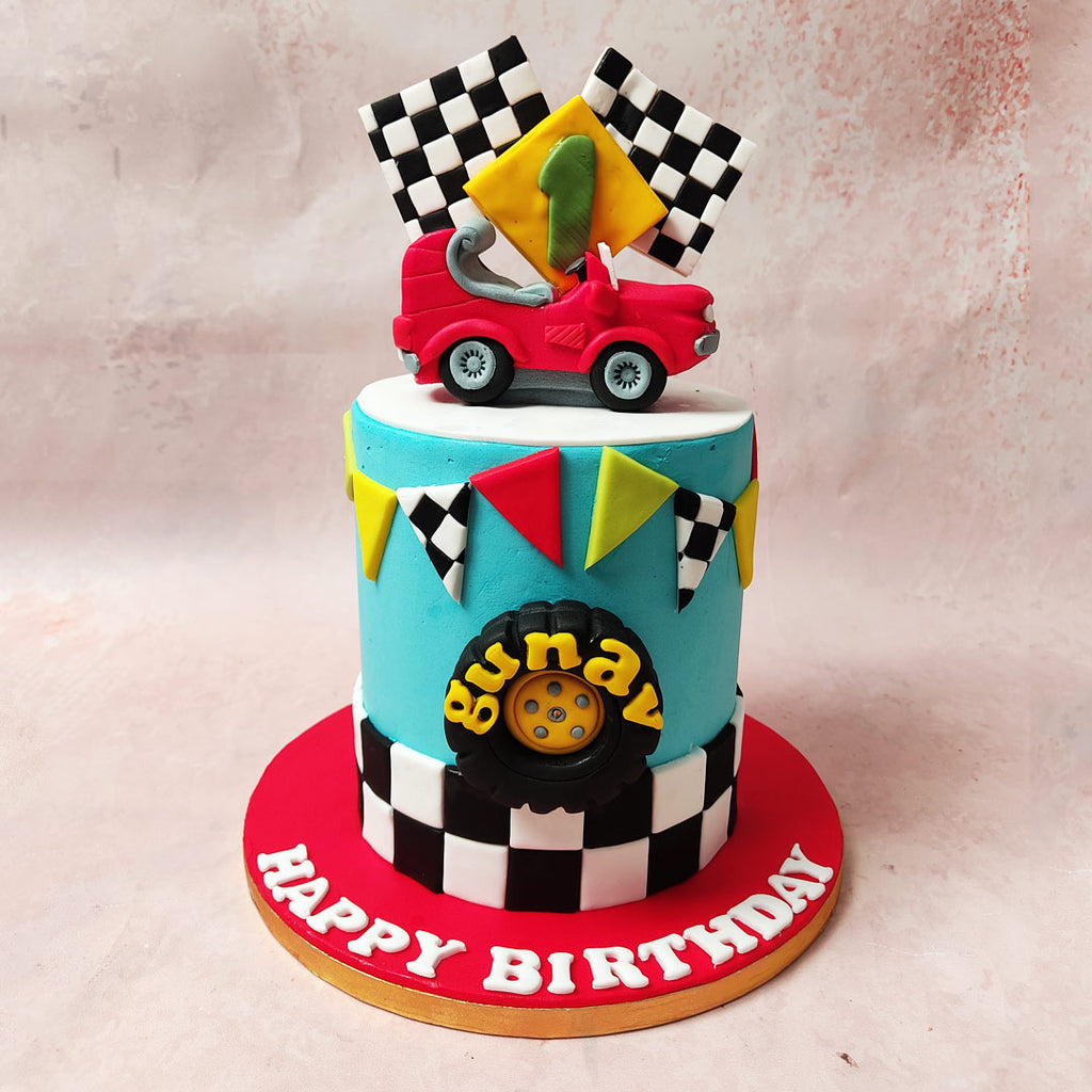 The light blue base of this Car Cake design, adorned with a chequered pattern at the bottom, sets the stage for a high-speed adventure.