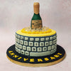 The yellow base of the champagne bucket cake design is wrapped in a vintage computer keyboard, symbolising the passage of time and the evolution of technology. 