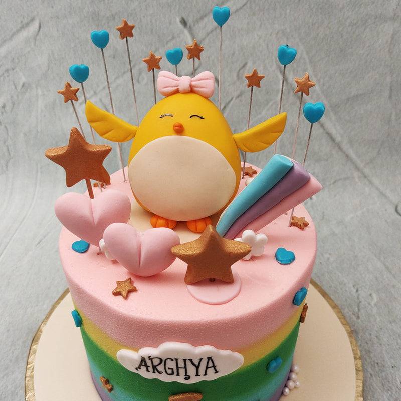 The stars and hearts on this little chick cake are embedded into the top as well like sparklers and lollipops, making the aesthetic a whole lot more festive.