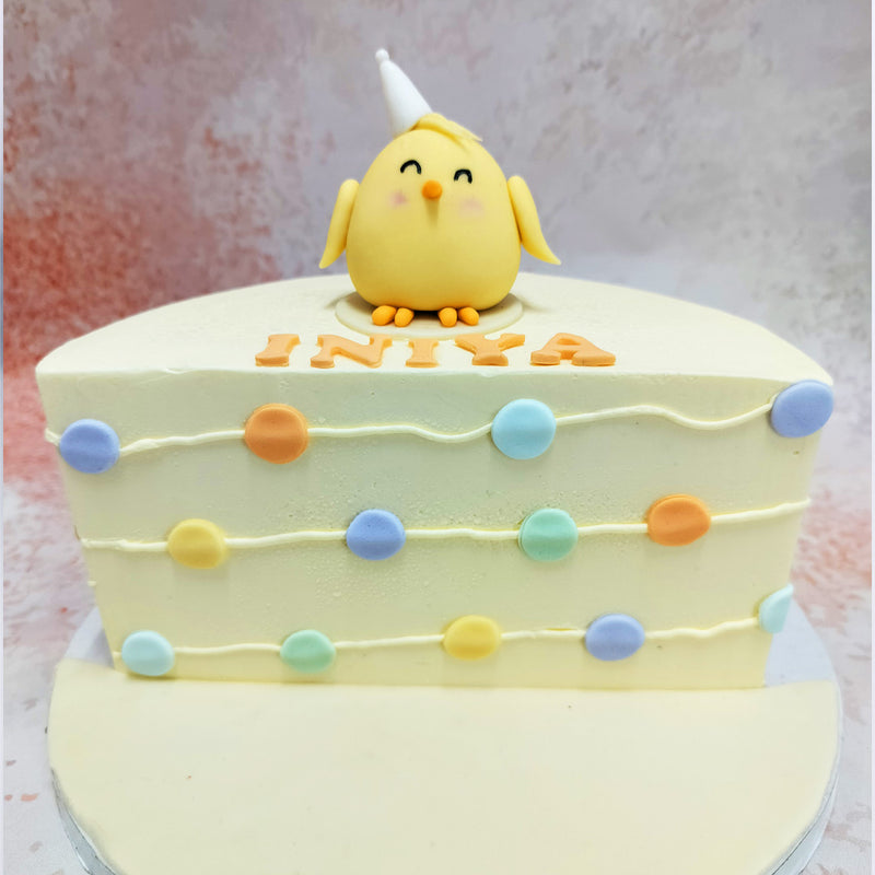 The bird, with its rosy cheeks and happy expression, adds a playful touch to this Six Months Birthday Cake, making it an instant hit with both children and adults. 