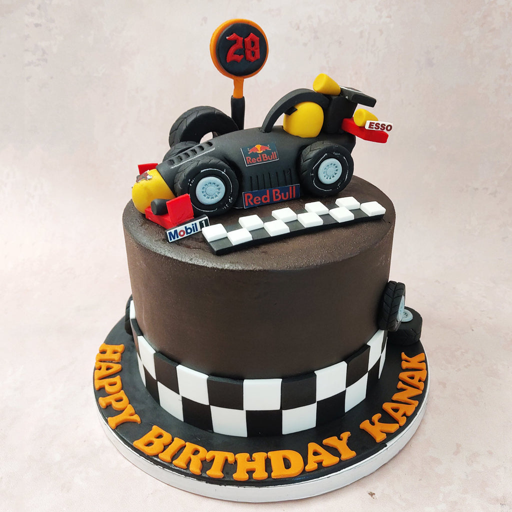 The foundation of this Formula 1 cake is a rich and indulgent chocolate base, representing the smooth and velvety track that F1 cars race on. It's like taking a bite out of victory! 