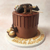 Picture layers of moist Chocolate Drip Cake, each one lovingly adorned with popsicle-shaped cake pops, miniature candy bars, and Ferrero Rocher chocolates. 